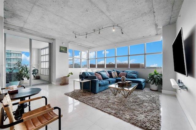 tiled living room with a healthy amount of sunlight