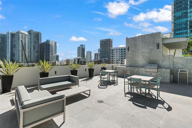 view of patio / terrace with area for grilling and an outdoor living space