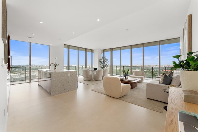 living area with visible vents and expansive windows
