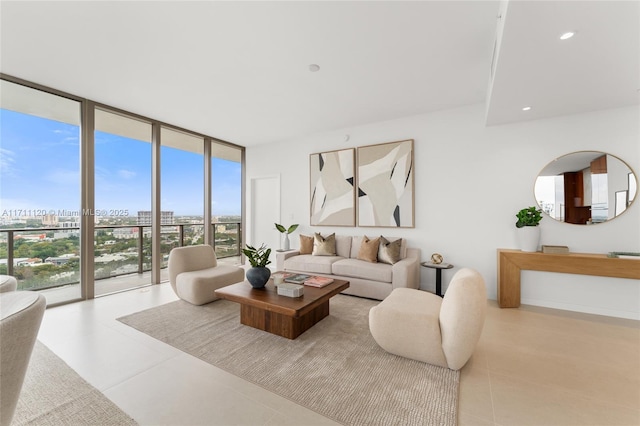 tiled living room with recessed lighting, a view of city, and a wall of windows