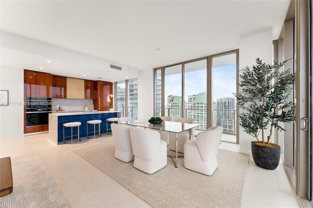 dining room featuring visible vents, recessed lighting, and light tile patterned floors