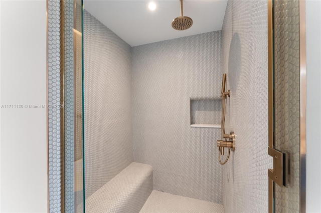 bathroom with tiled shower
