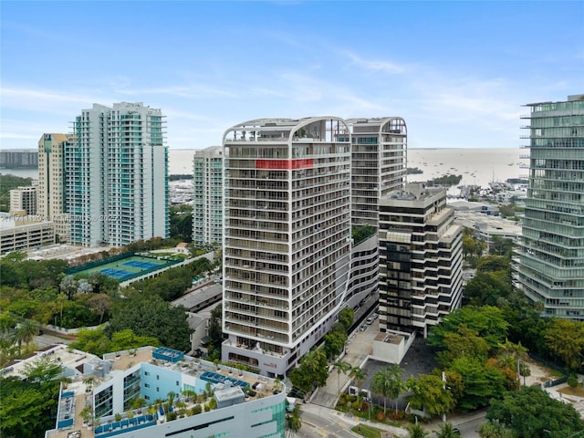view of property featuring a water view and a city view