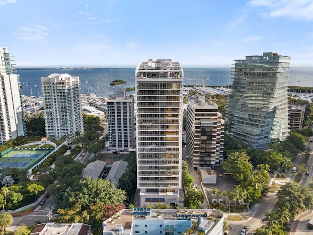 bird's eye view featuring a water view and a city view