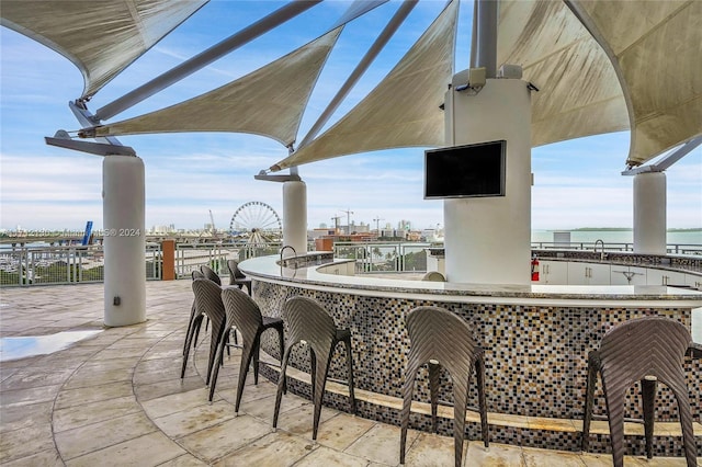 view of patio featuring an outdoor wet bar