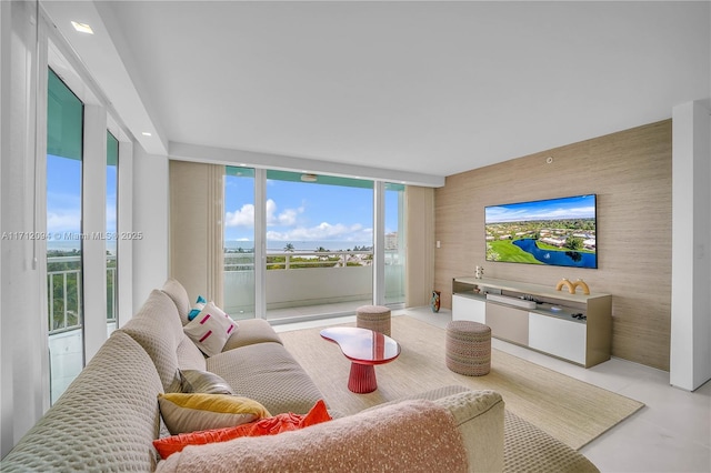 living room featuring a wall of windows