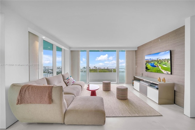 living room featuring a wall of windows