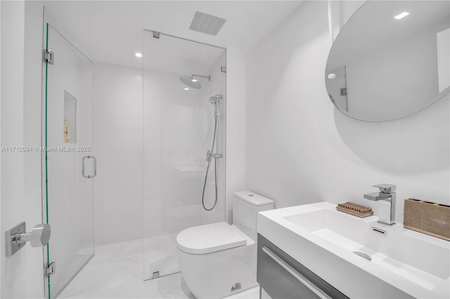 bathroom featuring walk in shower, vanity, and toilet