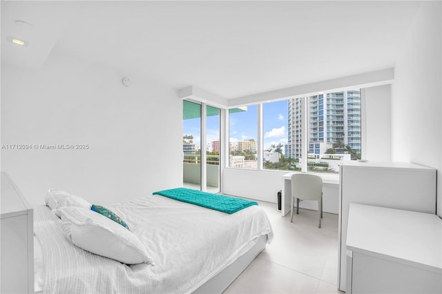 bedroom featuring light tile patterned flooring