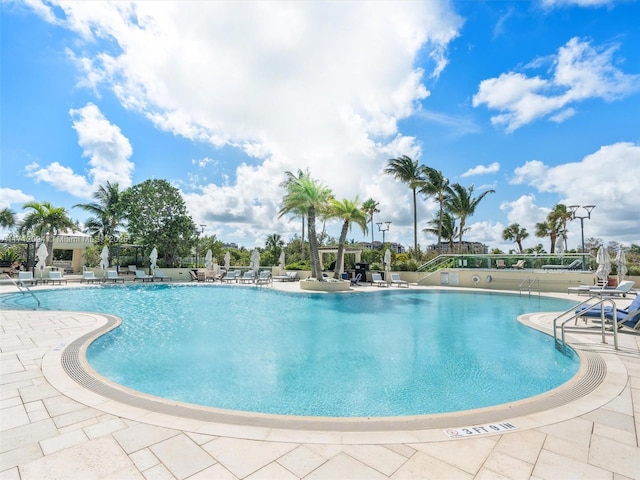 view of swimming pool with a patio