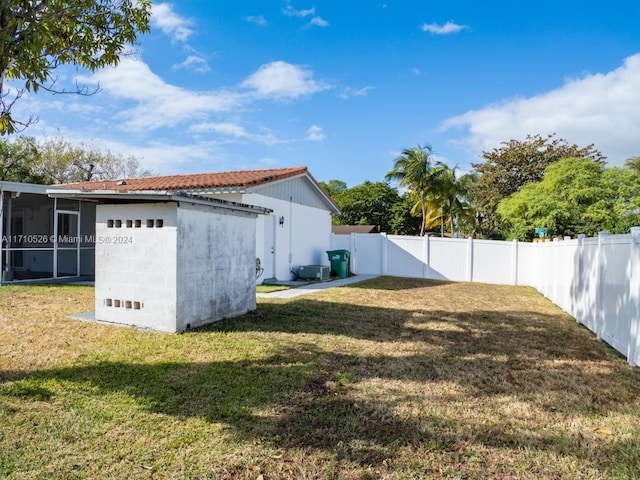 view of yard featuring a sunroom