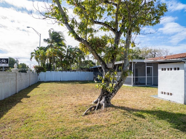 view of yard with a sunroom