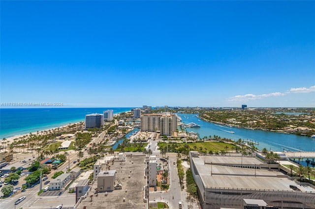 birds eye view of property featuring a water view and a beach view