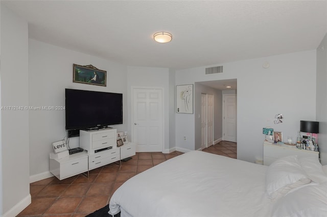 bedroom with tile patterned floors