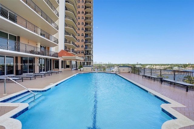 view of swimming pool featuring a patio