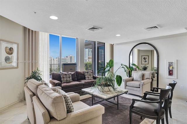 tiled living room with a textured ceiling