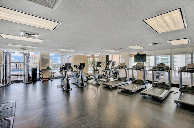 gym featuring a textured ceiling