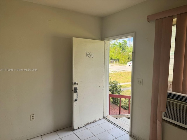 doorway featuring light tile patterned flooring