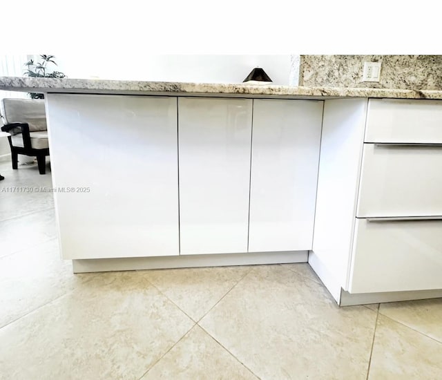 1016 Newcastle A 1016, Boca Raton, FL 33434 - kitchen view of white cabinets and light stone counters