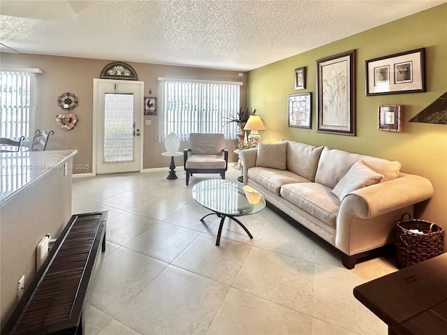 living room featuring plenty of natural light and a textured ceiling