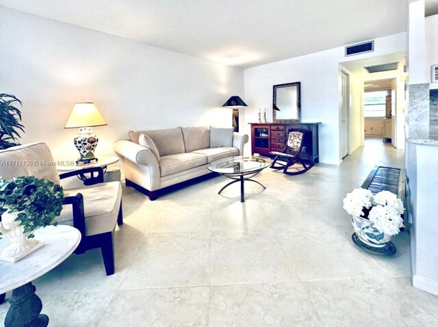 1016 Newcastle A 1016, Boca Raton, FL 33434 - living area with baseboards