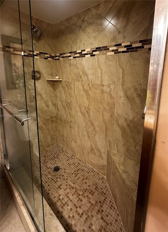 bathroom with a shower stall