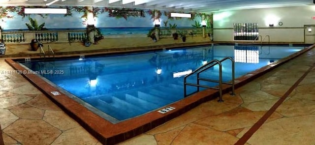 view of pool featuring fence