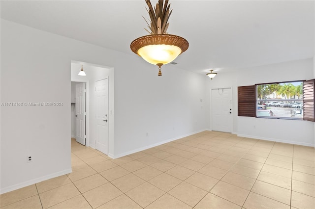 unfurnished room featuring light tile patterned floors