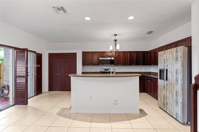 kitchen featuring an inviting chandelier, a center island with sink, hanging light fixtures, appliances with stainless steel finishes, and light tile patterned flooring