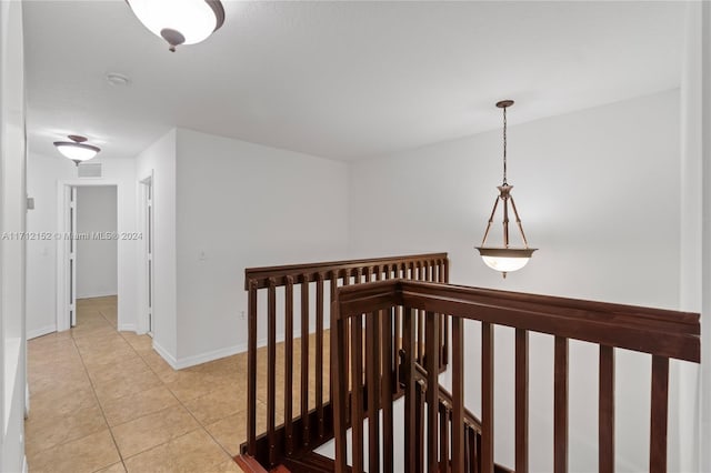 hall with light tile patterned flooring