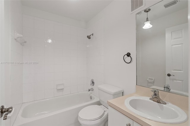 full bathroom featuring vanity, toilet, and tiled shower / bath