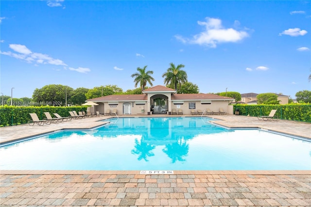 view of swimming pool with a patio area