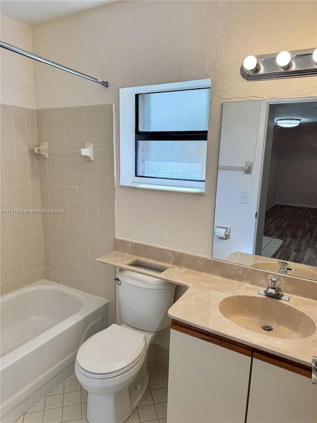 full bathroom featuring  shower combination, tile patterned floors, toilet, and vanity