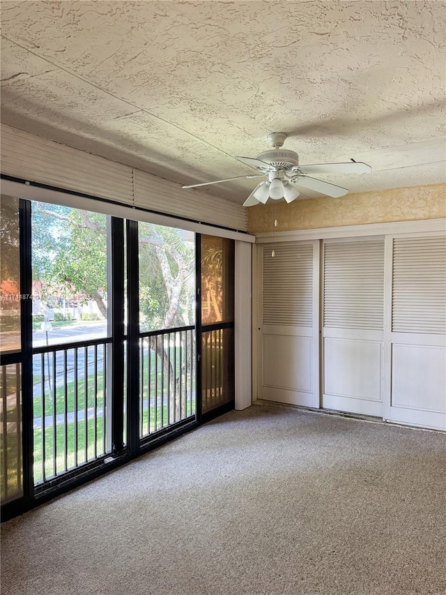 interior space featuring ceiling fan