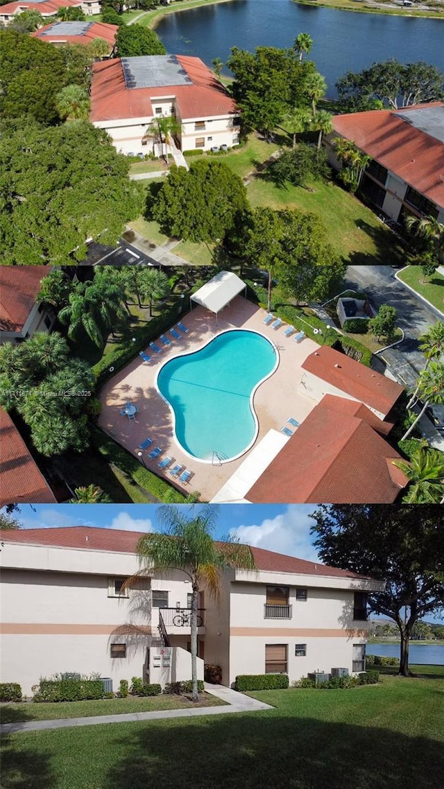 birds eye view of property with a water view