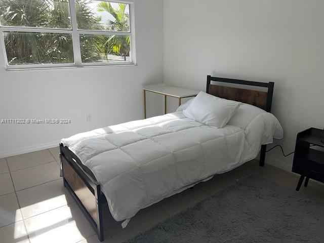 bedroom featuring tile patterned floors