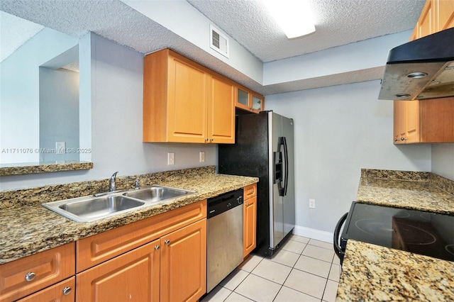 kitchen featuring sink, appliances with stainless steel finishes, extractor fan, a textured ceiling, and light tile patterned flooring