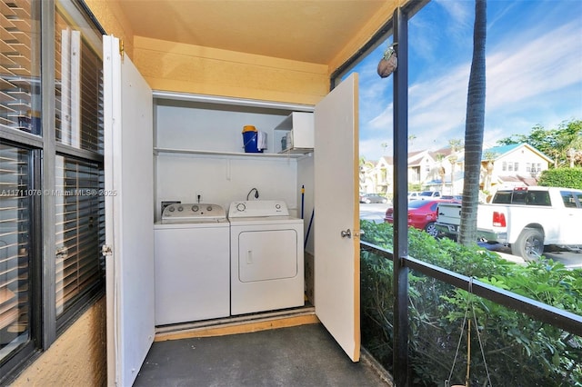 washroom with separate washer and dryer