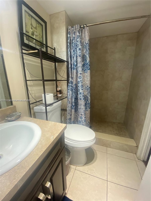 bathroom with walk in shower, tile patterned floors, toilet, and vanity