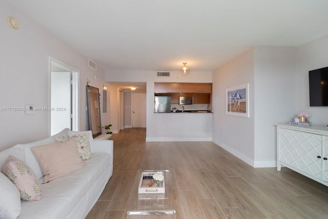 living room featuring light wood-type flooring