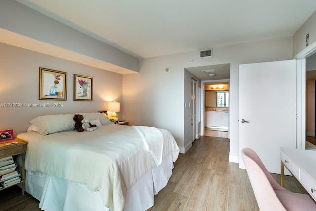 bedroom featuring light hardwood / wood-style floors