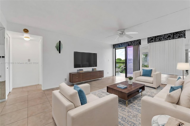 tiled living room with ceiling fan