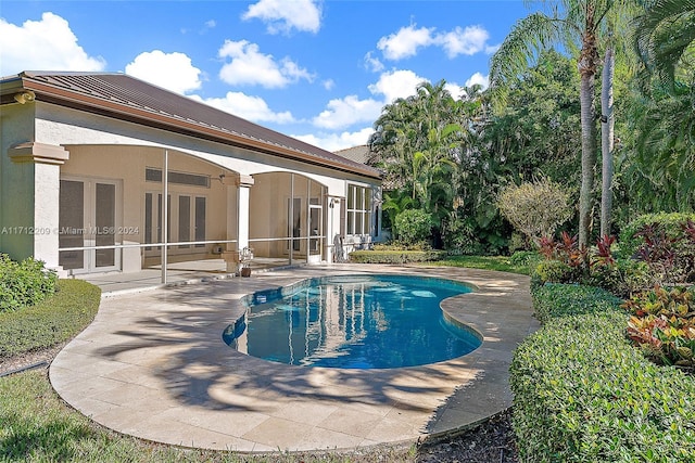 view of pool featuring a patio area