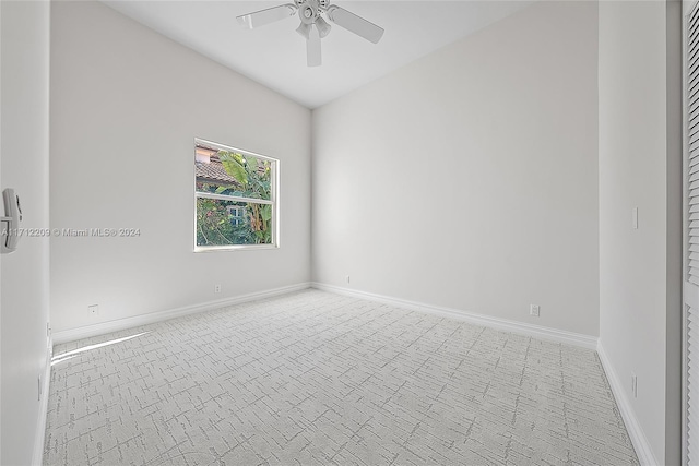 unfurnished room featuring ceiling fan and light colored carpet