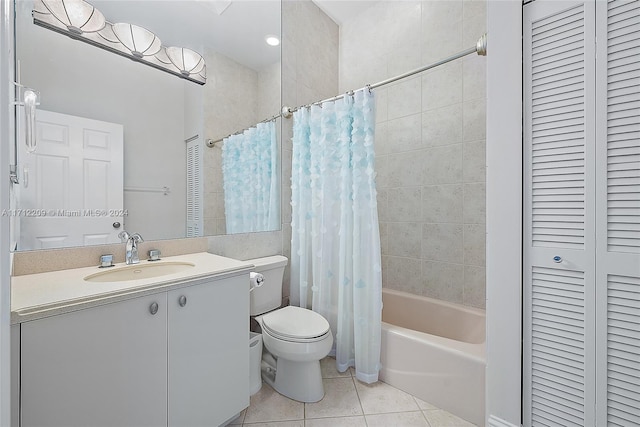 full bathroom featuring tile patterned floors, shower / bath combination with curtain, toilet, and vanity