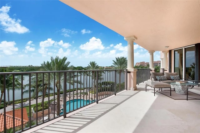 balcony featuring a water view