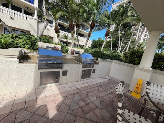 view of patio with an outdoor kitchen and area for grilling