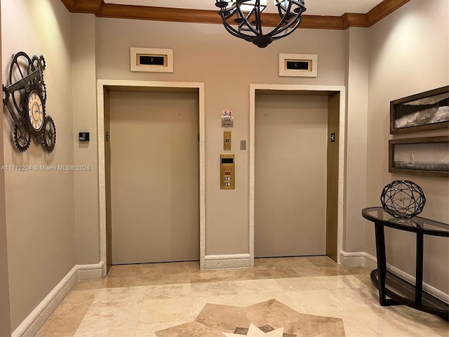 hall with elevator, crown molding, and an inviting chandelier