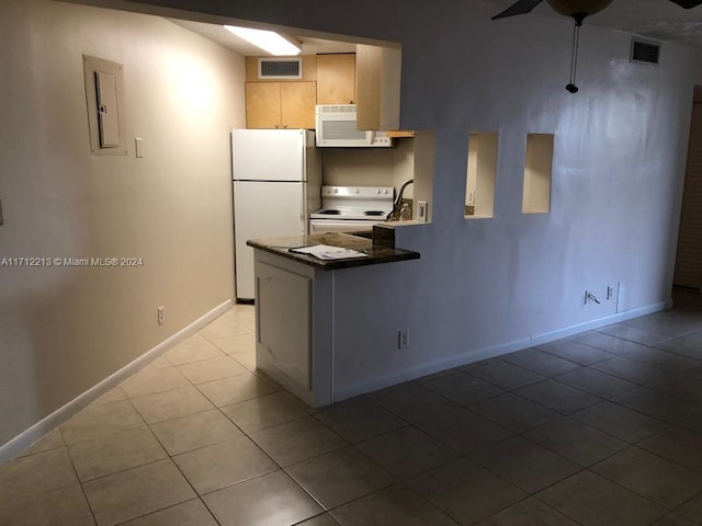 kitchen featuring kitchen peninsula, white appliances, light brown cabinets, light tile patterned floors, and electric panel