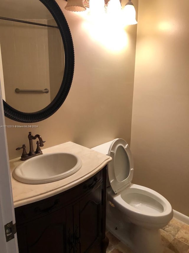 bathroom with vanity and toilet